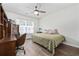 Comfortable bedroom featuring natural light, hardwood floors, ceiling fan, and furniture at 1127 Harvester Circle # 1127, Myrtle Beach, SC 29579