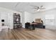 A bonus room featuring hardwood floors, ceiling fan, large window, and a bookcase at 1127 Harvester Circle # 1127, Myrtle Beach, SC 29579