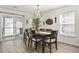 Elegant dining room with large table, stylish chairs, and sliding glass door at 1127 Harvester Circle # 1127, Myrtle Beach, SC 29579