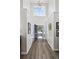 Bright foyer features hardwood floors, high ceilings, and a decorative light fixture at 1127 Harvester Circle # 1127, Myrtle Beach, SC 29579