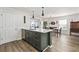 Open-concept kitchen with island, stainless steel appliances, and adjacent dining area at 1127 Harvester Circle # 1127, Myrtle Beach, SC 29579
