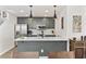 Well-lit kitchen features stainless appliances, shaker cabinets, and modern pendant lighting at 1127 Harvester Circle # 1127, Myrtle Beach, SC 29579