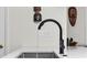 Close-up of a modern kitchen sink with sleek black faucet and decorative accents at 1127 Harvester Circle # 1127, Myrtle Beach, SC 29579