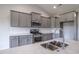 Close up of kitchen features modern stainless steel appliances and stylish gray cabinetry at 115 Old Chimney Ln, Conway, SC 29526