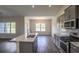 Kitchen area with central island, stainless steel appliances, and view to dining area at 115 Old Chimney Ln, Conway, SC 29526