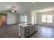 Bright open concept living space with kitchen, island, and stainless steel dishwasher at 115 Old Chimney Ln, Conway, SC 29526