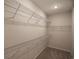 Spacious walk-in closet showcasing carpet floors and metal shelving at 115 Old Chimney Ln, Conway, SC 29526