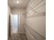 Spacious walk-in closet showcasing carpet floors and metal shelving at 115 Old Chimney Ln, Conway, SC 29526