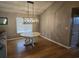 Dining room features wood floors, decorative light fixture and round table at 117 Wagon Wheel Ln., Surfside Beach, SC 29575