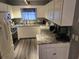 Modern kitchen featuring white cabinets, granite countertops and stainless steel appliances at 117 Wagon Wheel Ln., Surfside Beach, SC 29575