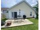 Outdoor patio area with table, chairs, grill, and privacy fence; perfect for entertaining at 117 Wagon Wheel Ln., Surfside Beach, SC 29575