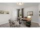 Bright home office features a wooden desk, chair, and ample natural light from the window at 1236 Barrington Way, Conway, SC 29526