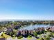 Aerial view of community with lakefront homes, lush landscaping, and ocean views at 124 Spartina Ct. # 30, Pawleys Island, SC 29585
