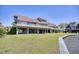 Spacious backyard with a well-maintained lawn, lakeside wooden dock and a spacious deck at 124 Spartina Ct. # 30, Pawleys Island, SC 29585