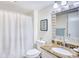 Well-lit bathroom with granite countertops, shower, and updated fixtures at 124 Spartina Ct. # 30, Pawleys Island, SC 29585