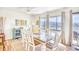 Bright dining area with views of the water, featuring a wooden dining table and plenty of natural light at 124 Spartina Ct. # 30, Pawleys Island, SC 29585