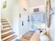 Welcoming entryway with wood stairs, bright lighting, and charming decor at 124 Spartina Ct. # 30, Pawleys Island, SC 29585