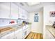 Cozy kitchen featuring white cabinets, granite countertops, and modern appliances at 124 Spartina Ct. # 30, Pawleys Island, SC 29585