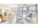Cozy living room with large windows, comfortable seating, and beautiful views of the water at 124 Spartina Ct. # 30, Pawleys Island, SC 29585