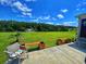 Relaxing backyard featuring a serene pond with a fountain, beautiful lawn, and patio seating area at 133 Lakeside Crossing Dr., Conway, SC 29526