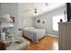 Cozy bedroom with hardwood floors, ceiling fan, and natural light from the window at 133 Lakeside Crossing Dr., Conway, SC 29526