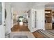 Welcoming entryway with hardwood floors flowing into an open-concept living space at 133 Lakeside Crossing Dr., Conway, SC 29526
