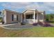 Charming one-story home with a cozy front porch and professionally landscaped yard at 133 Lakeside Crossing Dr., Conway, SC 29526