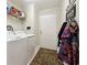 Functional laundry room with washer, dryer, storage shelf, and exterior access door at 133 Lakeside Crossing Dr., Conway, SC 29526