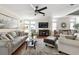 Hardwood floors, ceiling fan and neutral decor in this open living room and dining area at 133 Lakeside Crossing Dr., Conway, SC 29526