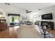 Open living room with hardwood floors and sliding glass doors to outdoor space at 133 Lakeside Crossing Dr., Conway, SC 29526