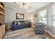 Cozy living room with a comfortable sofa, accent chair, and bright natural light at 133 Lakeside Crossing Dr., Conway, SC 29526
