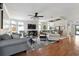 Bright living room featuring hardwood floors, ceiling fan, and dining area at 133 Lakeside Crossing Dr., Conway, SC 29526