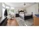 Bright and airy main bedroom with wood floors and large bay window at 133 Lakeside Crossing Dr., Conway, SC 29526