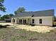 The house's rear exterior showcases a covered patio, large windows and clean design at 133 Thrush Ct., Georgetown, SC 29440