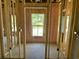 Interior framing showcasing a framed window and doorway in the unfinished space ready for customization at 133 Thrush Ct., Georgetown, SC 29440