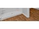 Shower with a white surround and wood-look floors at 1368 Palm Springs Paloma Dr, Longs, SC 29568