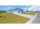 Beautiful light-blue single-Gathering home with a spacious driveway and attached garage at 1368 Palm Springs Paloma Dr, Longs, SC 29568