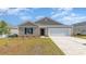 Charming single-story home with a well-manicured lawn and a two-car garage at 1406 Nokota Dr., Conway, SC 29526