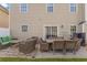 Back patio with dining table, conversation set and grill offers a relaxing outdoor space at 1439 Brighton Ave., Myrtle Beach, SC 29588