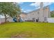 Large, green backyard features a playset, plenty of room to run and patio with furniture at 1439 Brighton Ave., Myrtle Beach, SC 29588