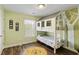 Charming ' bedroom features a unique bunk bed with a house-like structure and hardwood flooring at 1439 Brighton Ave., Myrtle Beach, SC 29588