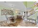 Open-concept dining area with beautiful flooring, decor, leads to living area and staircase at 1439 Brighton Ave., Myrtle Beach, SC 29588