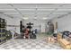 Spacious garage with checkered floor and ample storage space for various equipment and items at 1439 Brighton Ave., Myrtle Beach, SC 29588