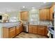 Updated kitchen with stainless appliances, wood cabinets, and efficient layout at 1439 Brighton Ave., Myrtle Beach, SC 29588