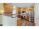 Well-equipped kitchen with wood cabinetry, stainless steel appliances, and a functional layout at 1439 Brighton Ave., Myrtle Beach, SC 29588