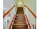 Staircase features wood steps with white risers and a wood railing at 1439 Brighton Ave., Myrtle Beach, SC 29588
