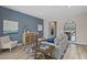 Cozy living room with modern decor, blue accent wall, stylish furniture and ample natural light at 1513 Seachase Way, North Myrtle Beach, SC 29582