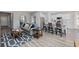 Open-concept living room featuring hardwood floors, modern decor, and seamless kitchen access at 1513 Seachase Way, North Myrtle Beach, SC 29582
