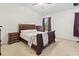 Bedroom with a dark wooden bed frame and matching furniture at 157 Olde Towne Way # 4, Myrtle Beach, SC 29588
