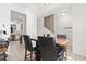 Bright dining area featuring a hardwood table, seating for four and kitchen view at 157 Olde Towne Way # 4, Myrtle Beach, SC 29588